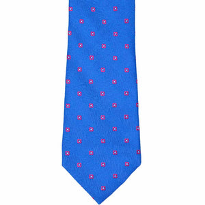 The front of a blue tie with small pink flowers