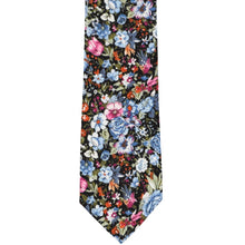 Load image into Gallery viewer, The front of a dusty blue and black floral tie, laid out flat