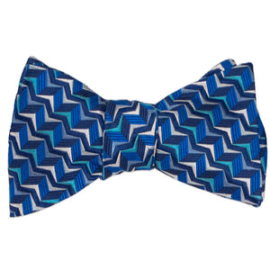 A tied self-tie bow tie in a blue geometric pattern