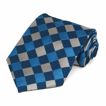 Load image into Gallery viewer, A bright blue, navy blue and silver large print check necktie rolled to show off pattern
