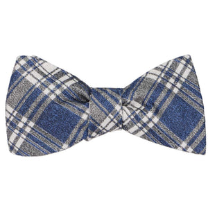 A tied blue and gray plaid self-tie bow tie