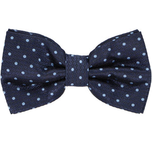A pre-tied bow tie in a blue on blue polka dot pattern