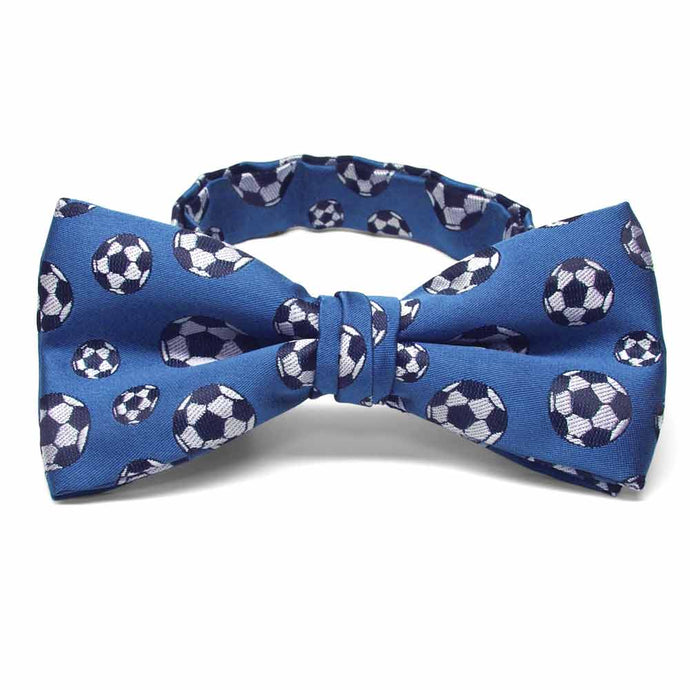 Soccer theme bow tie on a blue background.