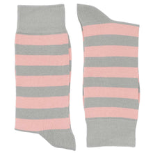 Load image into Gallery viewer, A pair of blush pink and gray striped socks, folded