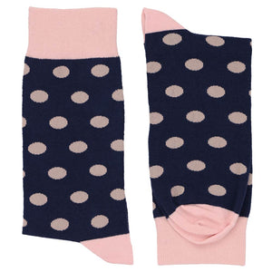 Pair of blush pink and navy blue polka dot socks
