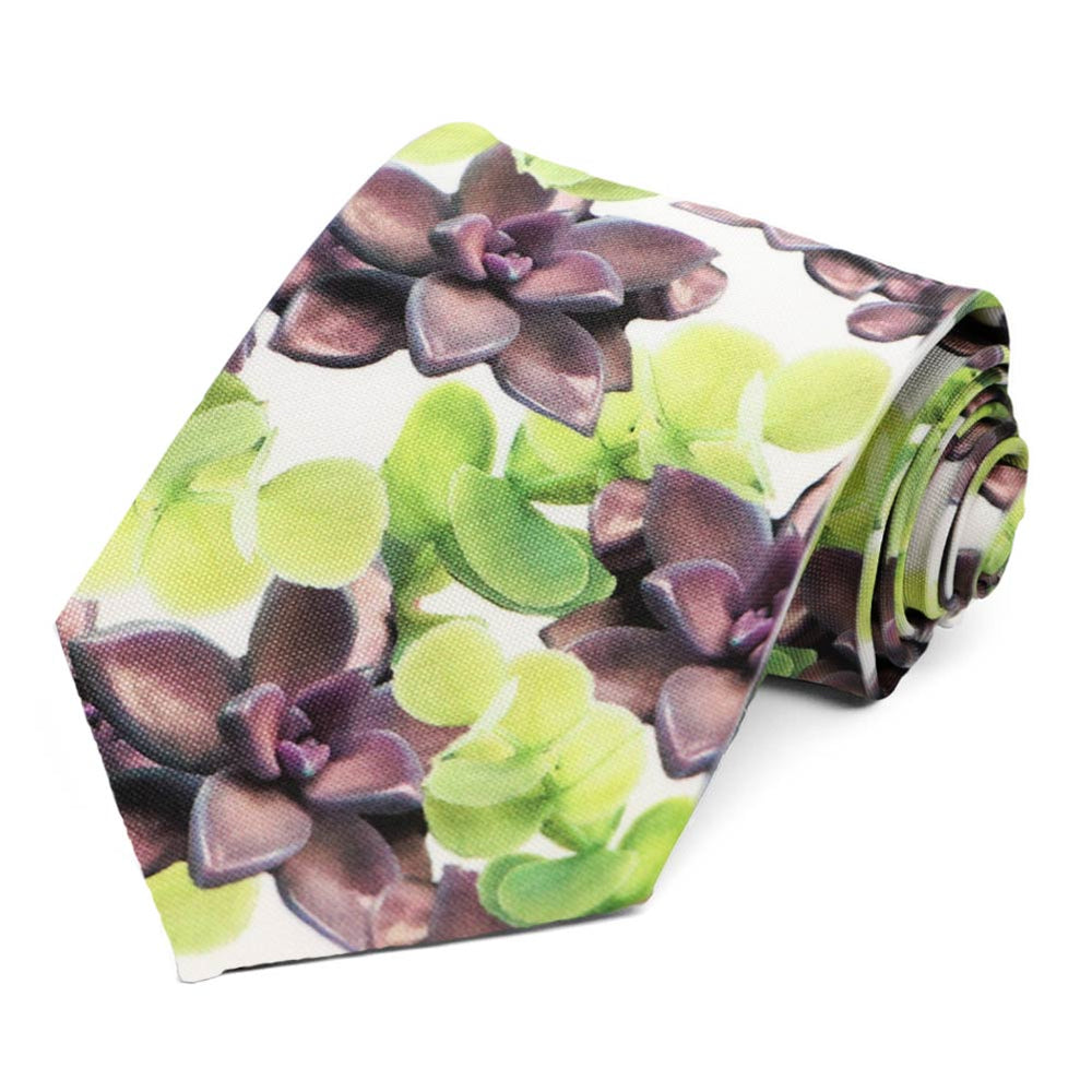 A rolled botanical themed necktie featuring green and purple succulents