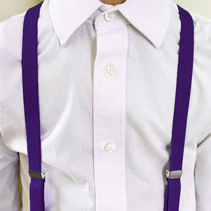 Boy wearing amethyst purple suspenders with a white dress shirt