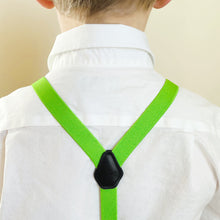 Load image into Gallery viewer, The back of a child wearing a white dress shirt and hot lime green suspenders