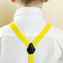 Load image into Gallery viewer, The back of a boy wearing yellow suspenders with a white dress shirt