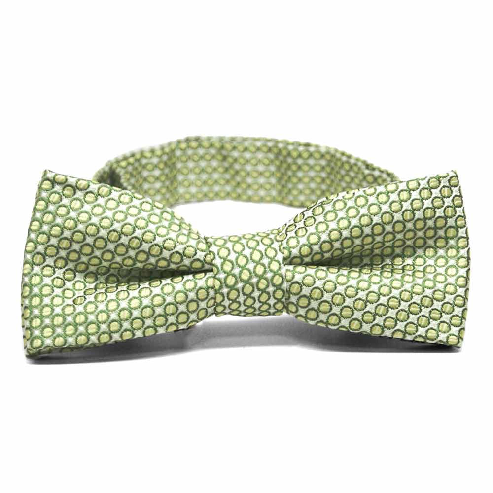 Front view of a light green circle pattern boys' bow tie