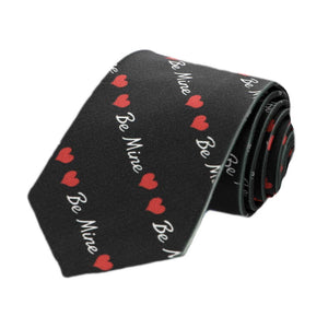 A boys black and red striped be mine novelty tie, rolled to show off the pattern