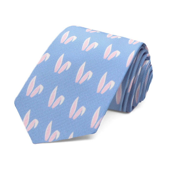 A blue boys tie with a pink and white bunny ears pattern