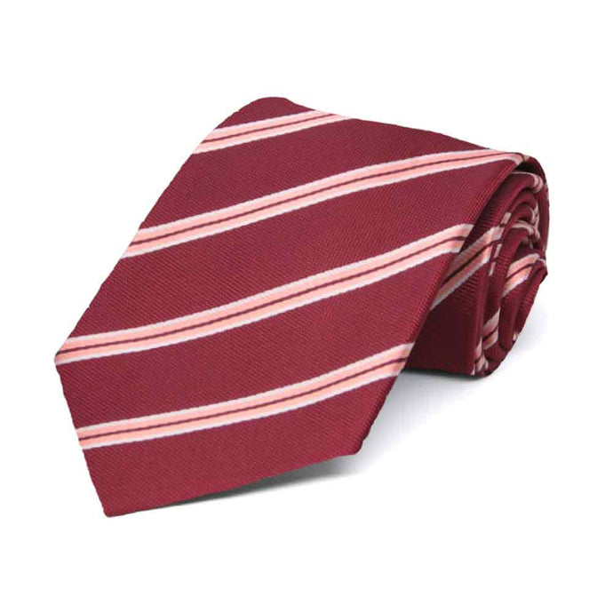 Burgundy and pink striped boys' necktie, rolled view