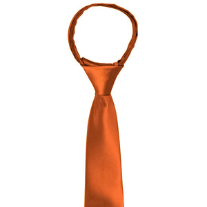 The knot and front of a boys zipper tie