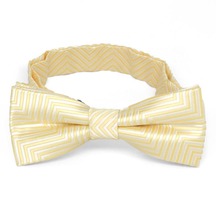 Front view of a light yellow and white chevron pattern boys' bow tie
