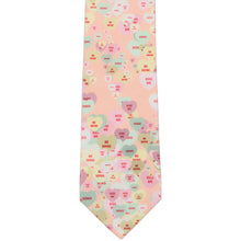 Load image into Gallery viewer, The front of a slim tie in a pastel colored scattered candy hearts pattern