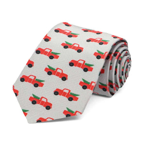 A boys gray tie with a Christmas red pickup truck design on a gray background