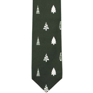 The front of a dark green tie with white decorated trees