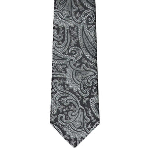 The front view of a boys black paisley tie