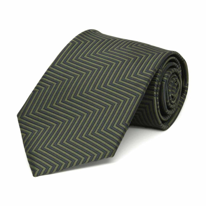 Rolled view of a boys' dark green and sage green chevron pattern tie