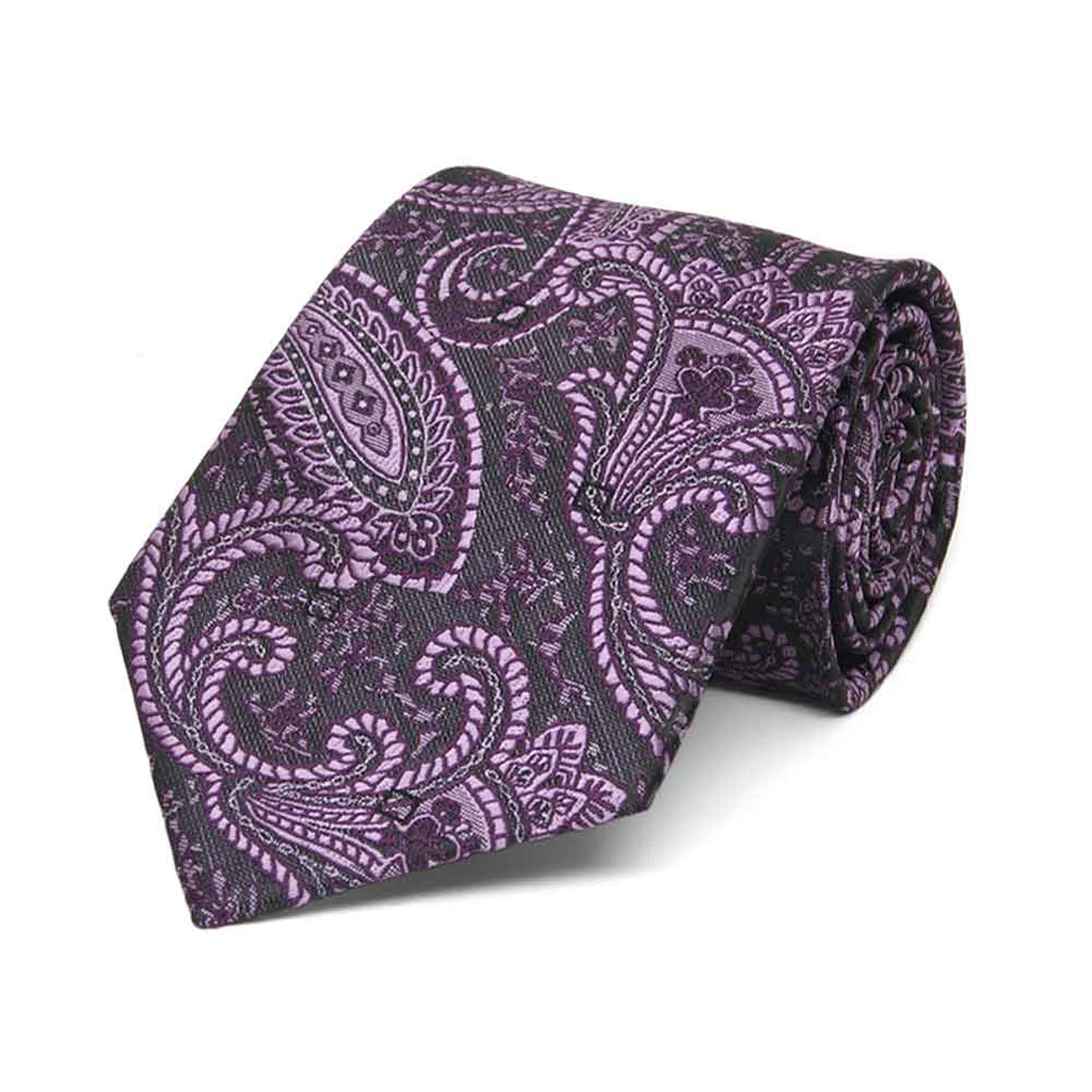 Boys' eggplant paisley necktie, rolled to show pattern up close