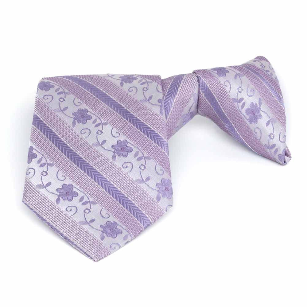 Folded front view of a light purple floral stripe clip-on style boys' tie