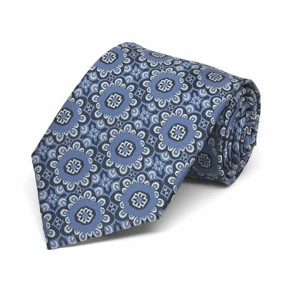 Rolled view of a blue and white floral pattern boys' necktie