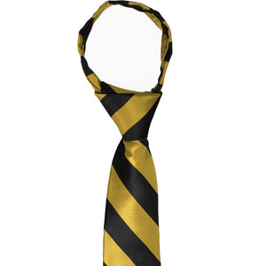 Front view of a boys' gold and black striped zipper tie