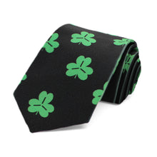 Load image into Gallery viewer, A boys green and black shamrock themed St. Patrick&#39;s Day tie, rolled to show off the pattern