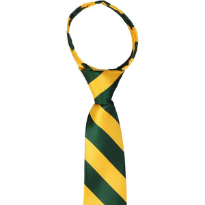 Knot and collar on a boys hunter green and golden yellow striped zipper tie