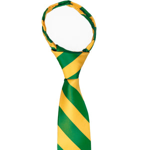 The knot and collar on a kelly green and golden yellow striped zipper tie