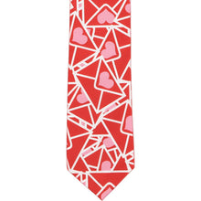 Load image into Gallery viewer, The front of a boys necktie with a Valentine envelope pattern in red and pink