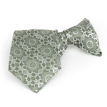 Load image into Gallery viewer, Front folded view of a mint green floral pattern boys&#39; clip-on style tie