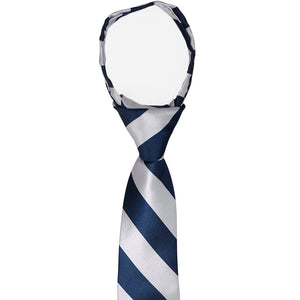 The knot and collar view on a boys' navy blue and silver striped zipper tie
