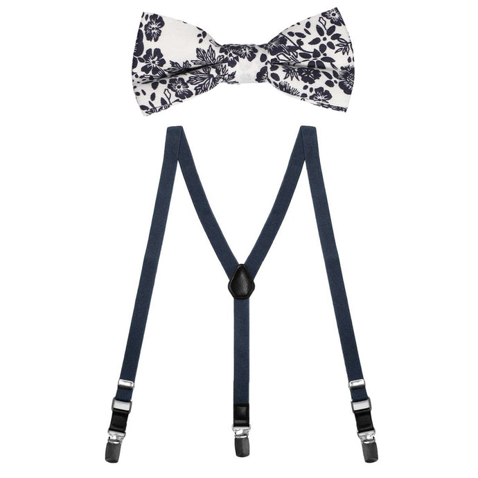 A boys' navy blue and white floral bow tie paired with navy solid suspenders