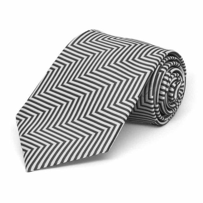 Boys' gray and white chevron striped tie, rolled to show pattern up close