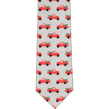Load image into Gallery viewer, The front of a boys&#39; gray tie with Christmas red pickup trucks