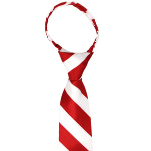 Knot and collar of a children's size red and white striped zipper tie
