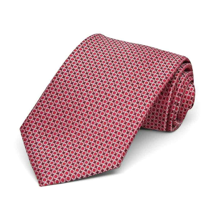 Red circle pattern boys' necktie, rolled to show texture