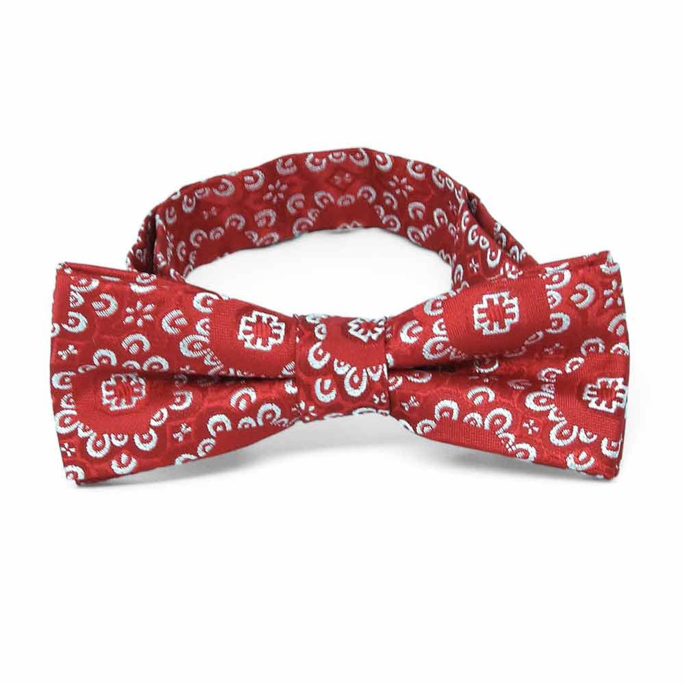 Front view of a red and white floral pattern boys' bow tie