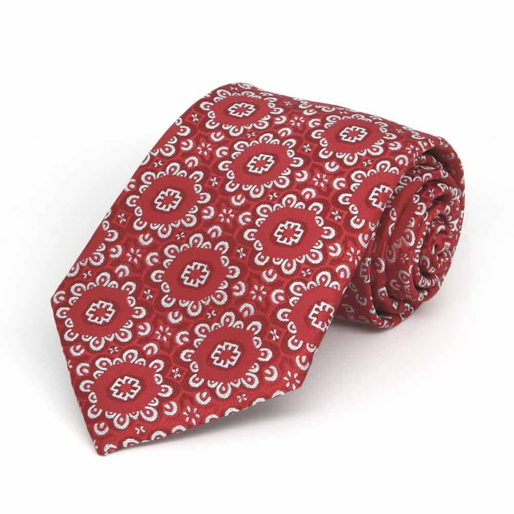 Rolled view of a red and white floral pattern boys' necktie