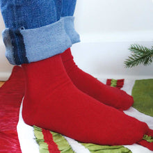 Load image into Gallery viewer, A closeup of a child wearing a pair of red solid color socks with rolled up jeans