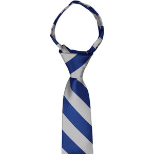 The knot and collar on a boys' royal blue and silver striped zipper tie