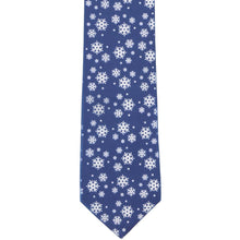 Load image into Gallery viewer, The front of a dark blue tie with scattered snowflakes