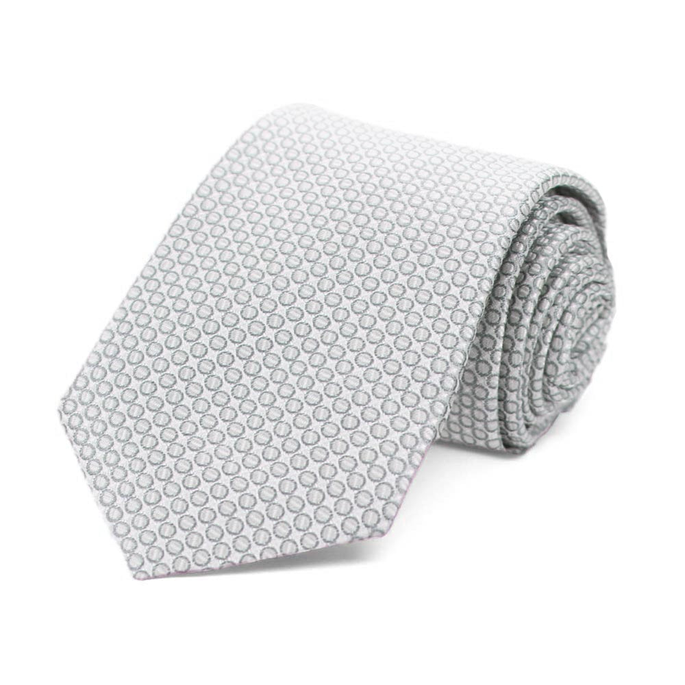 Light gray circle pattern boys' necktie, rolled to show texture  Edit alt text