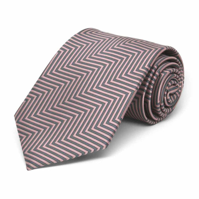Rolled view of a pink and gray chevron pattern necktie