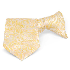 Boys' light yellow paisley clip-on tie, folded front view