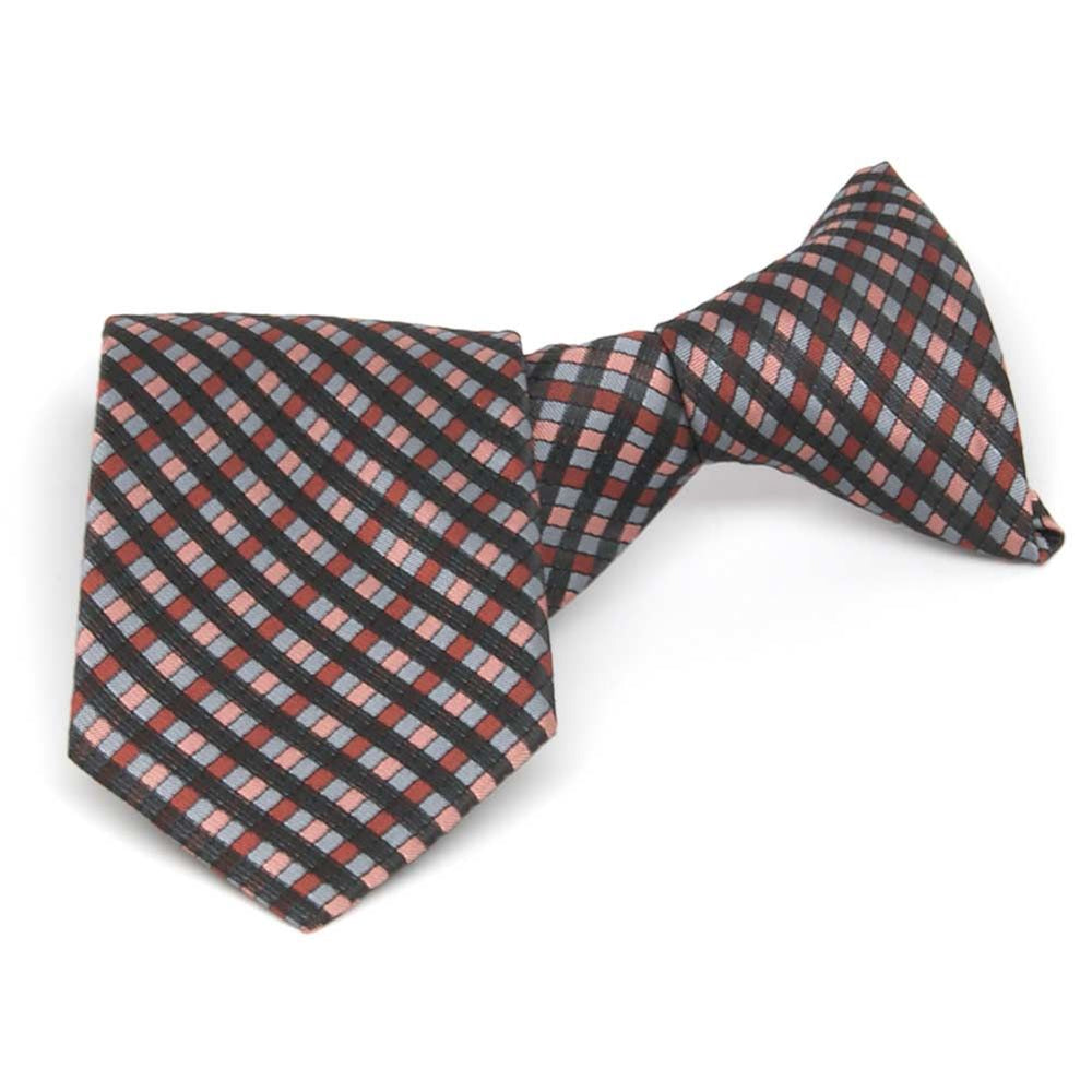 Boys' terracotta, mauve and black plaid clip-on tie, folded front view