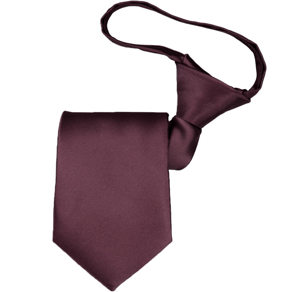 A boys pre-tied zipper tie, folded to display the knot and tie tip