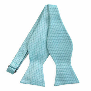 An untied light blue self-tie bow tie with a cross hatch pattern
